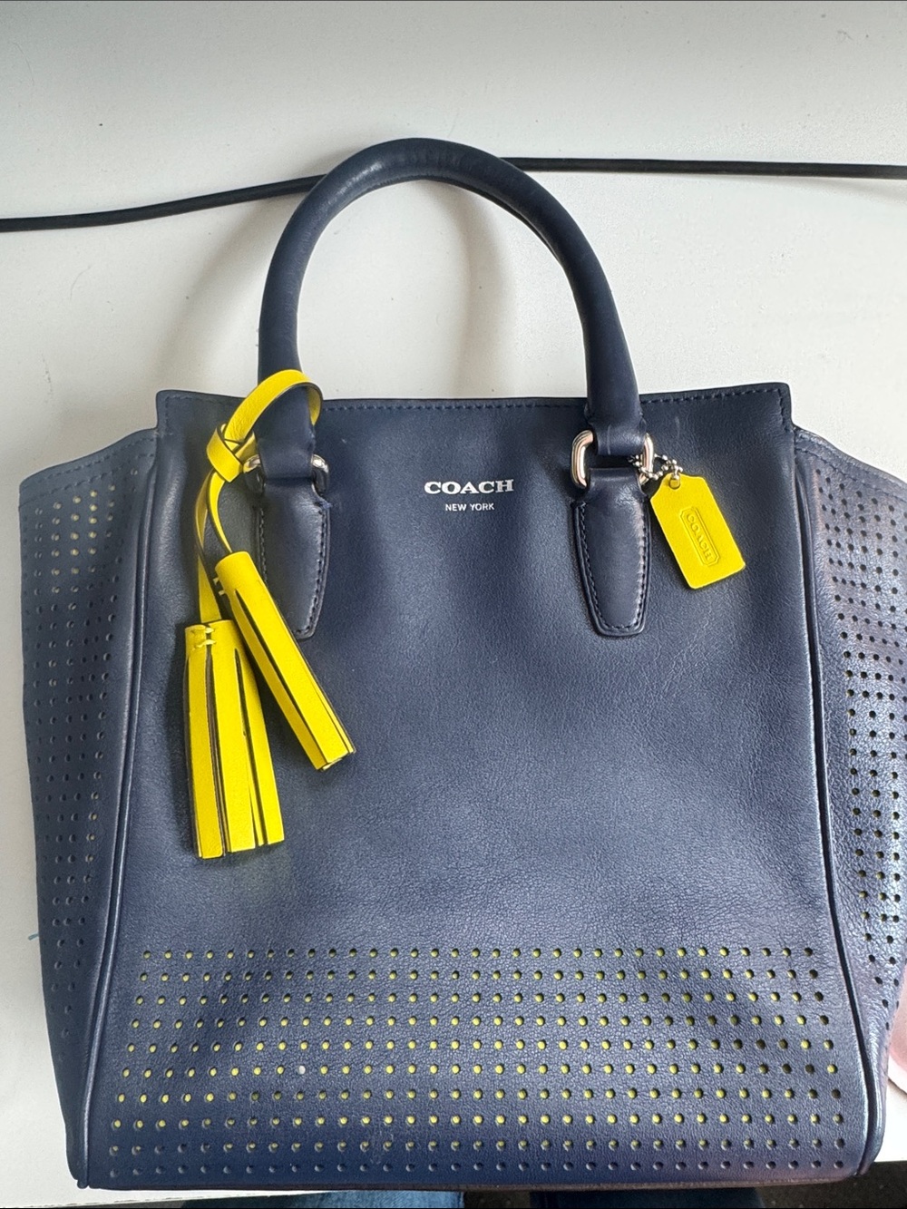 Coach Legacy Mini-Tanner tote in navy blue with yellow accent